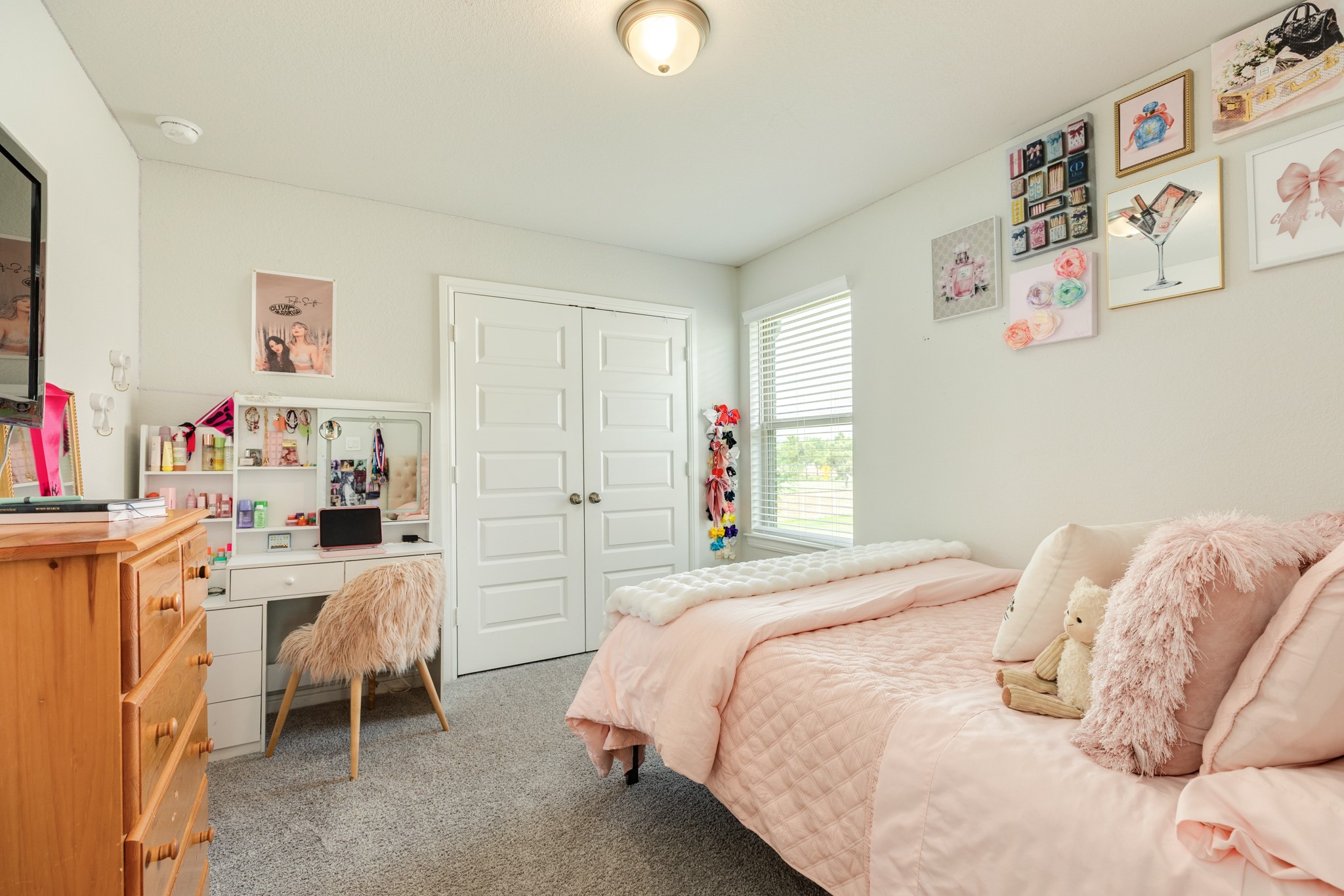 10306 Aldrin Drive Rosharon, TX 77583 - Photo 26 of 50 Secondary bedroom featuring a large window, double closet doors, and a very spacious layout.