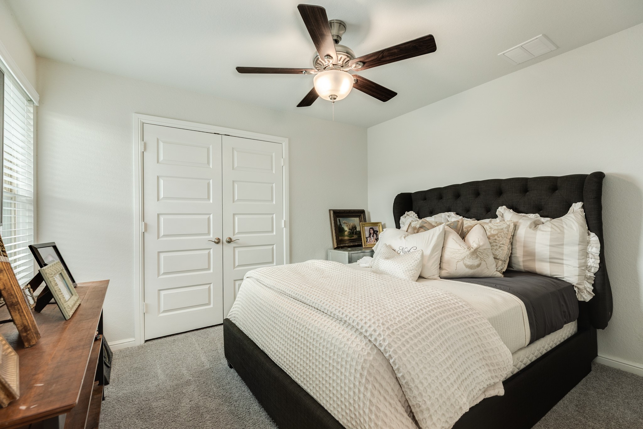 10306 Aldrin Drive Rosharon, TX 77583 - Photo 27 of 50 Guest ensuite located to the left at the top of the stairs. Features like-new carpet, double closet doors, and is spacious.