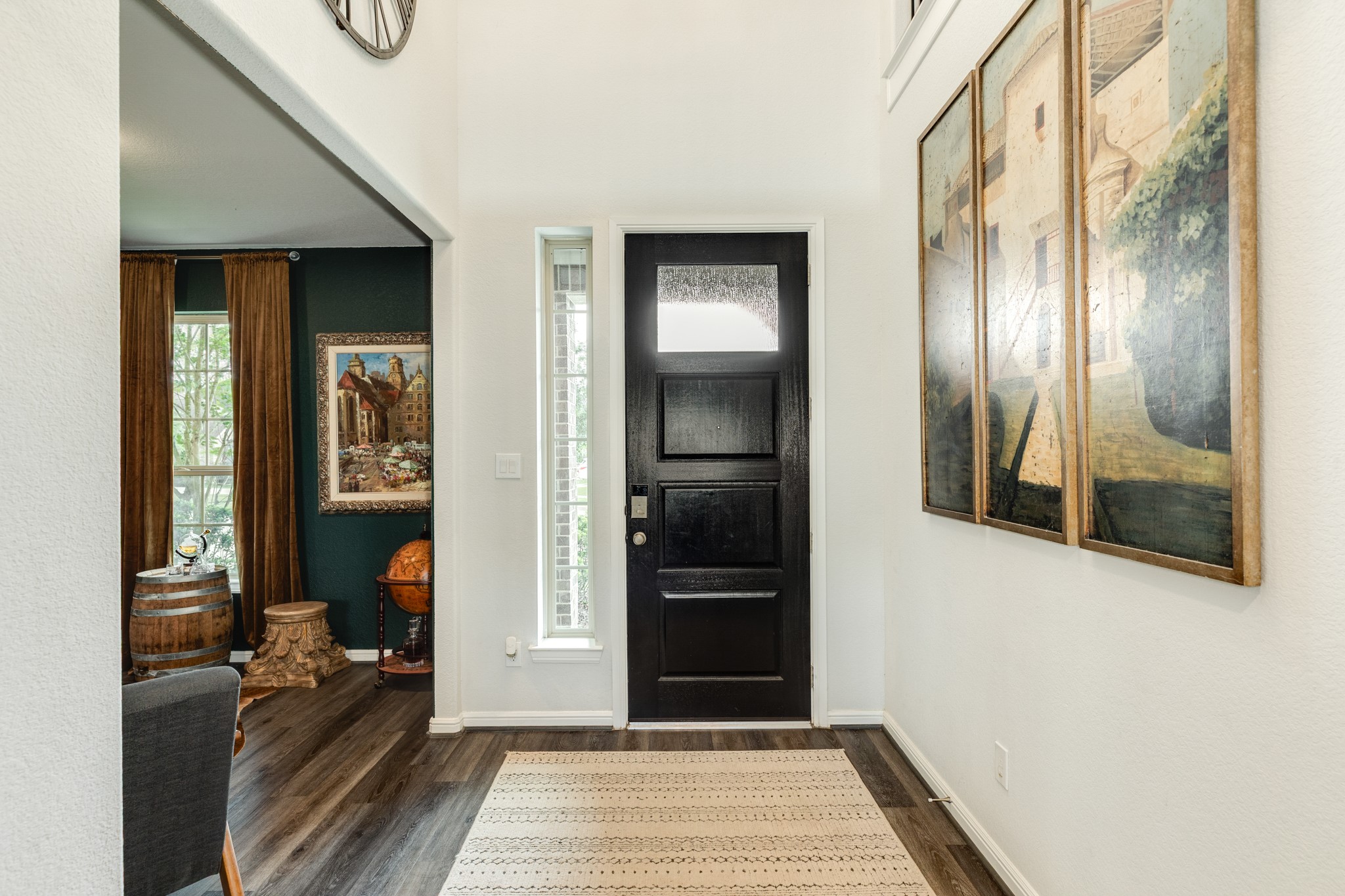 10306 Aldrin Drive Rosharon, TX 77583 - Photo 3 of 50 When you enter the front door, you're greeted by beautiful engineered wood floors and high ceilings.