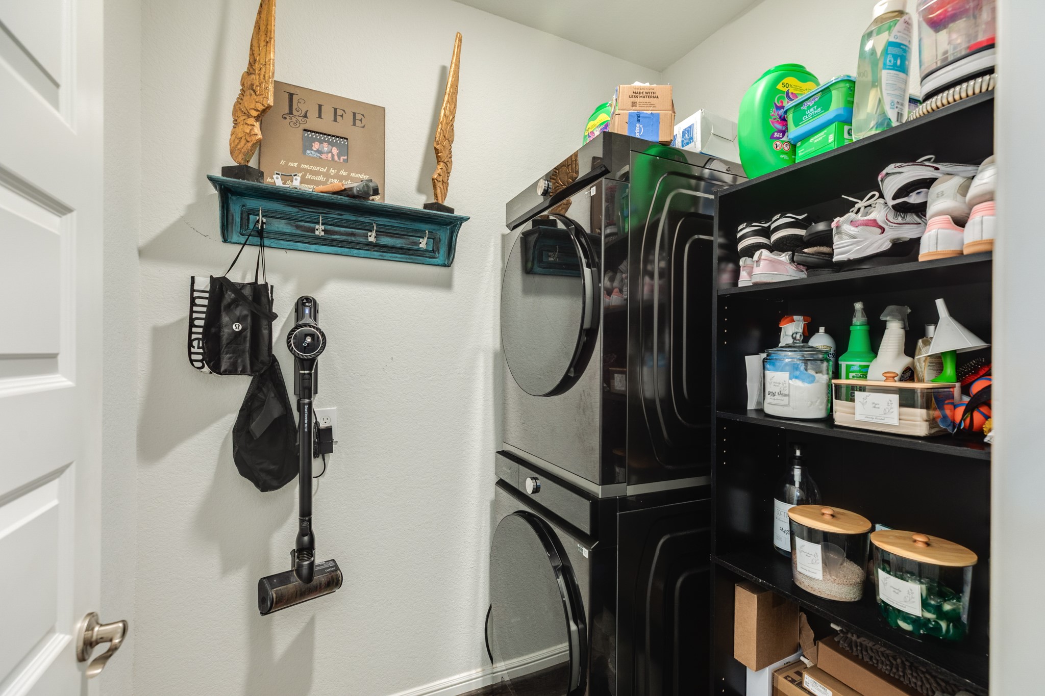 10306 Aldrin Drive Rosharon, TX 77583 - Photo 30 of 50 Laundry room is conveniently located on the first floor, offering ample storage space and includes all necessary appliances.