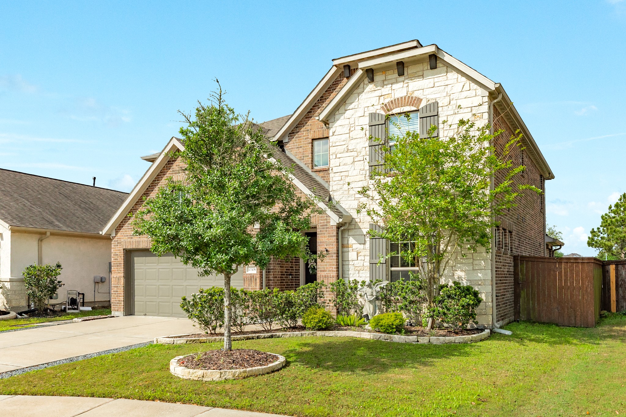 10306 Aldrin Drive Rosharon, TX 77583 - Photo 32 of 50 This meticulously maintained home boasts excellent landscaping and a double driveway, providing ample parking space.