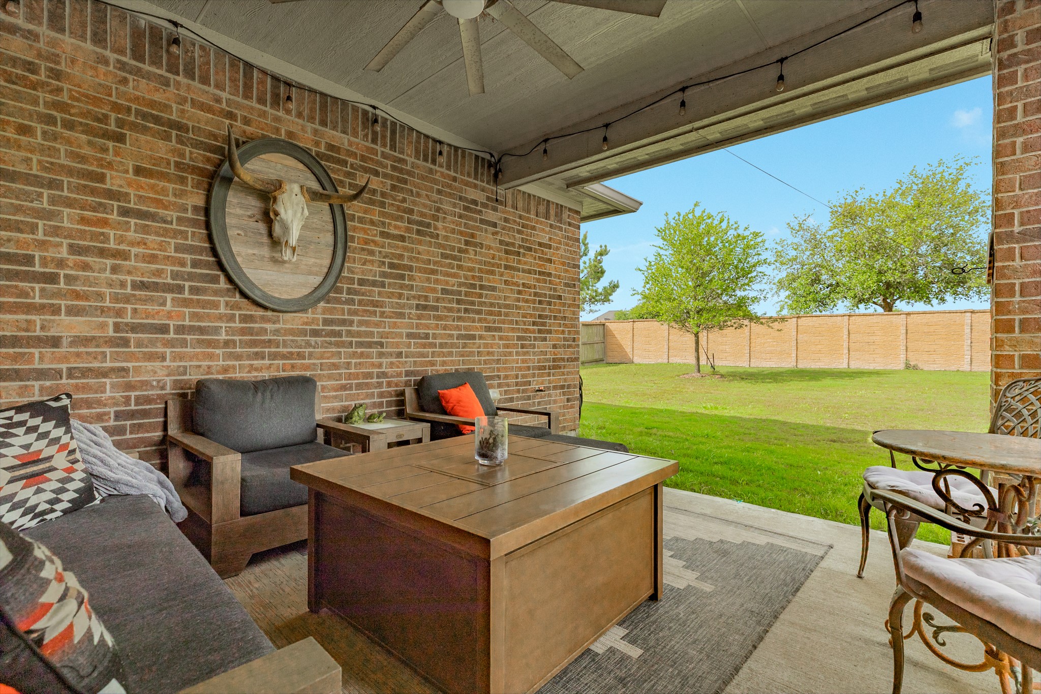 10306 Aldrin Drive Rosharon, TX 77583 - Photo 35 of 50 Close view of the covered patio and oversized backyard, perfect for creating a tranquil oasis.