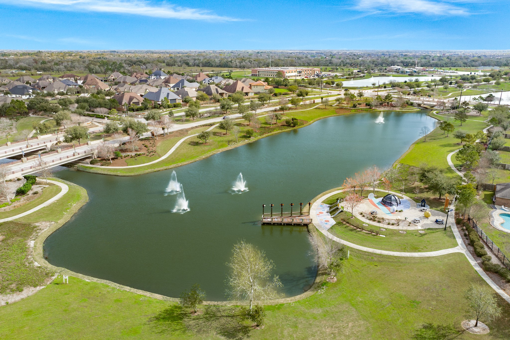 10306 Aldrin Drive Rosharon, TX 77583 - Photo 44 of 50 One of the many lakes in Meridiana, this one is within walking distance of your new home. It features a playground, and the pond is stocked, allowing for fishing.