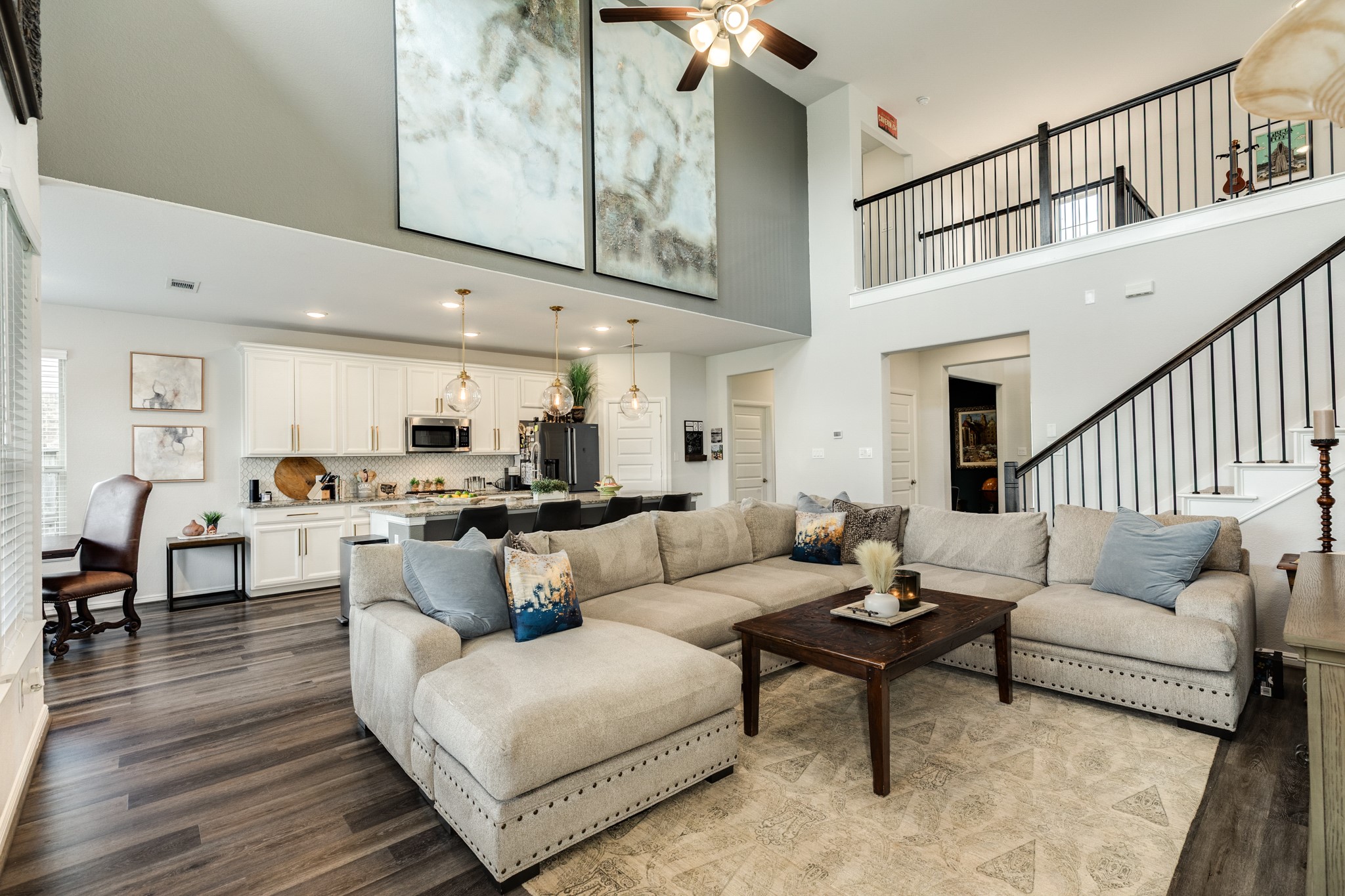 10306 Aldrin Drive Rosharon, TX 77583 - Photo 50 of 50 This property features an open floor plan with high ceilings, and engineered wood floors throughout the family area and kitchen.