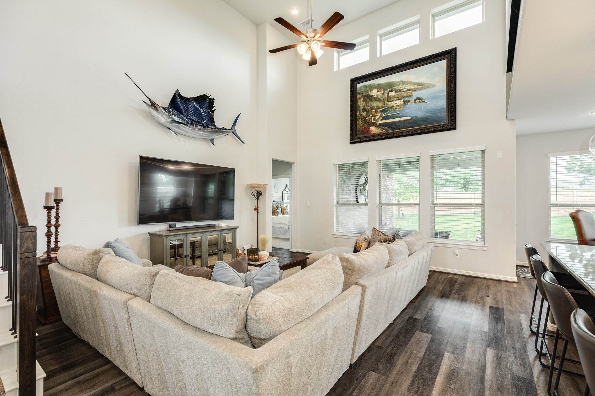 10306 Aldrin Drive Rosharon, TX 77583 - Photo 9 of 50 This view highlights the wall of windows, the high ceiling, and the spaciousness of the family area.