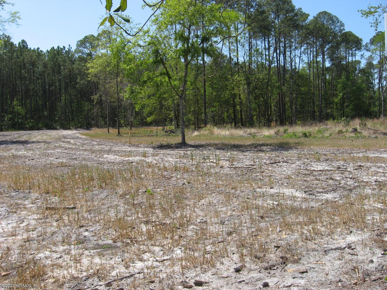 Lot 5 Church Road Callahan, FL 32011 - Photo 2 of 4 a backyard of a house with lots of green space