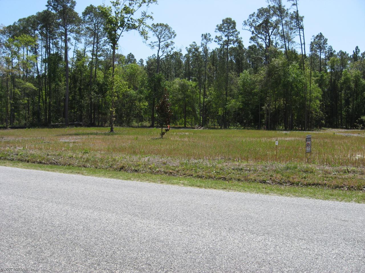 Lot 5 Church Road Callahan, FL 32011 - Photo 3 of 4 a view of a field with trees in the background