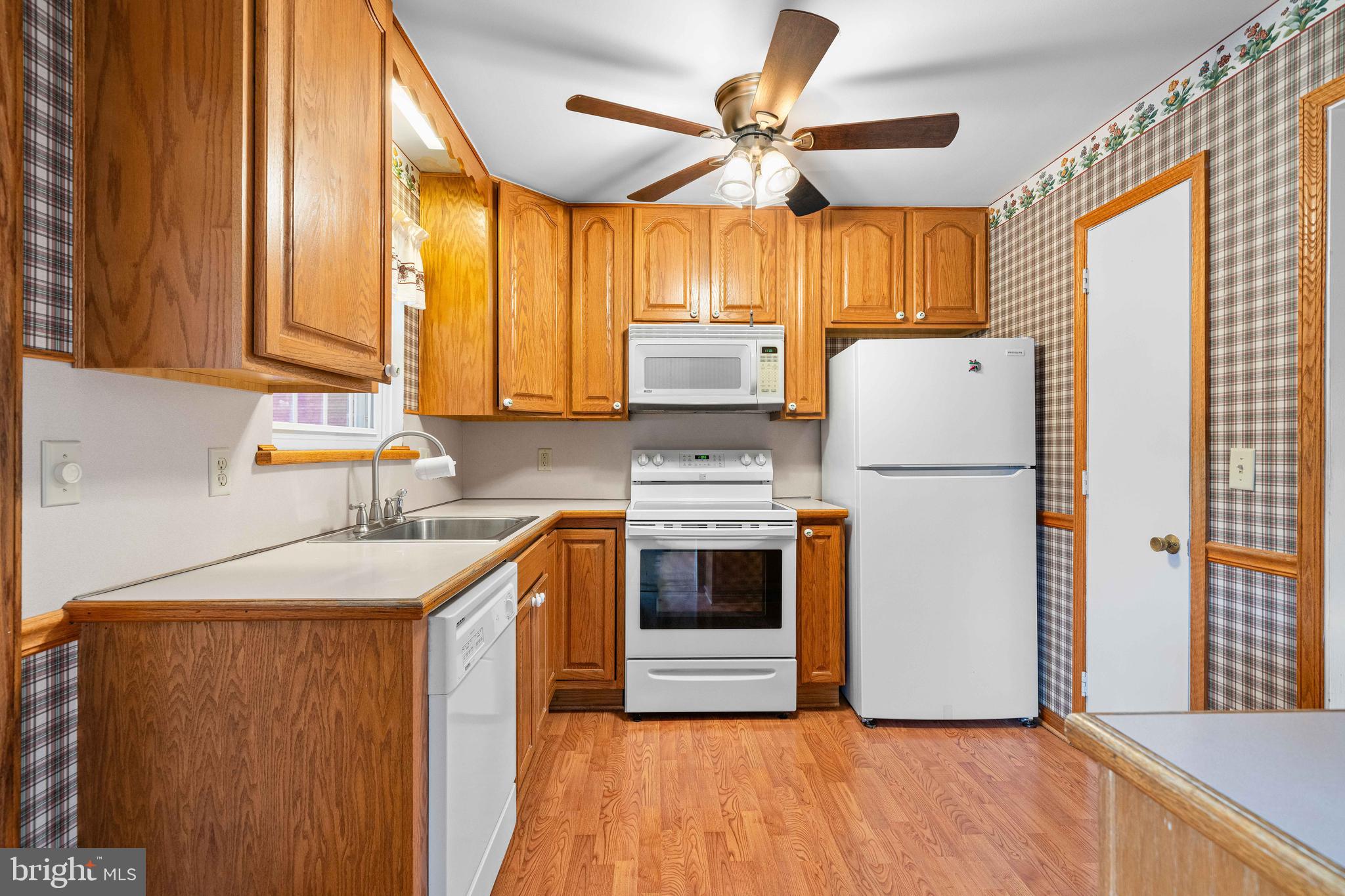 8 Deep Branch Drive Townsend, DE 19734 - Photo 11 of 42 a kitchen with a sink a refrigerator and a stove