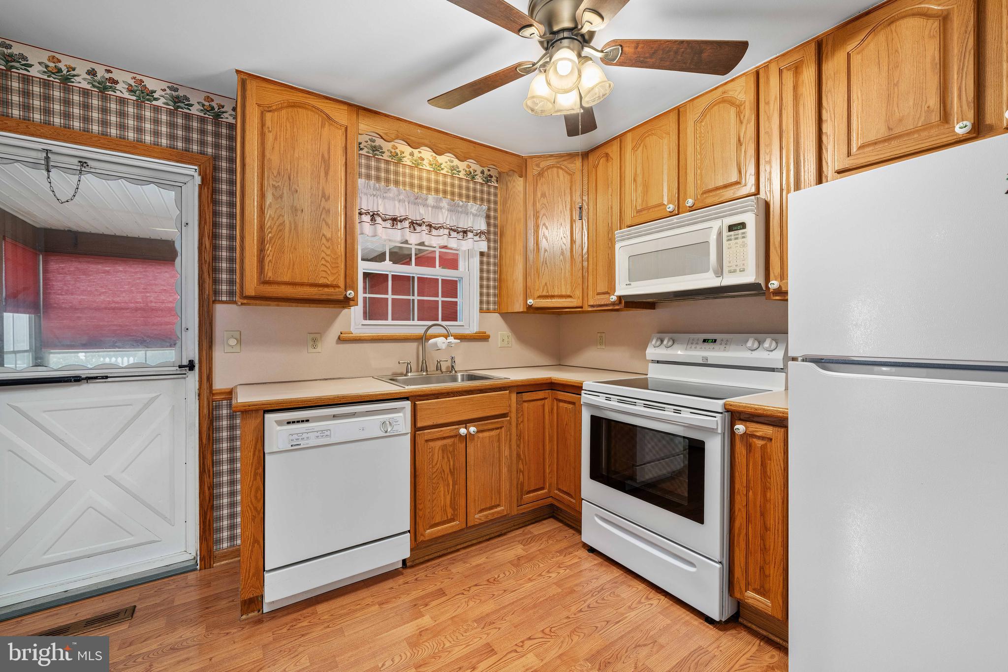 8 Deep Branch Drive Townsend, DE 19734 - Photo 12 of 42 a kitchen with stainless steel appliances granite countertop a stove and a microwave