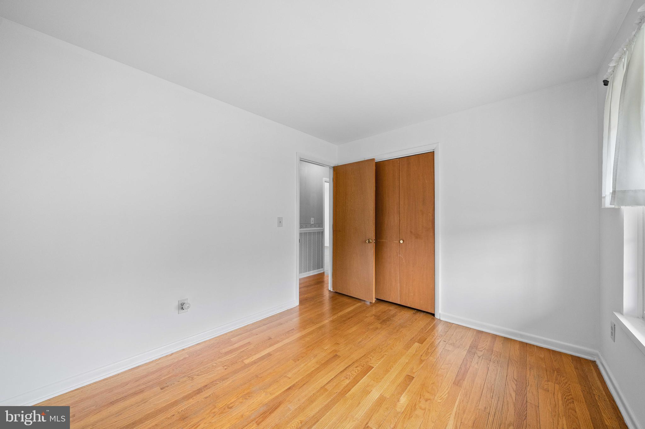 8 Deep Branch Drive Townsend, DE 19734 - Photo 20 of 42 a view of an empty room with wooden floor and closet