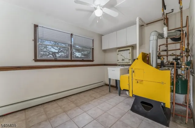 a room with gym equipment and a window