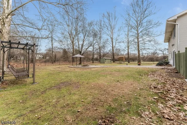 a backyard of apartments with large trees