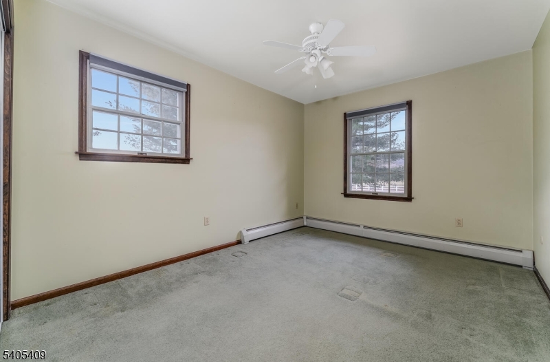 217 Van Syckles Road Hampton, NJ 08827 - Photo 9 of 16 an empty room with windows