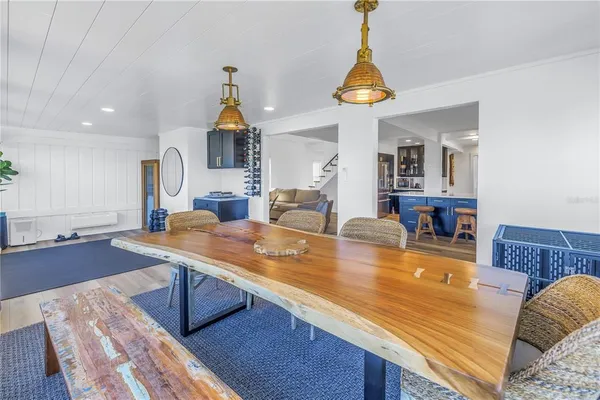 a room with furniture a mirror and a potted plant