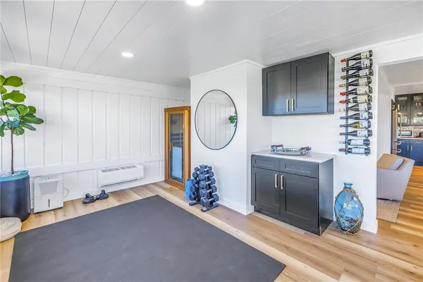 a living room with furniture and potted plant