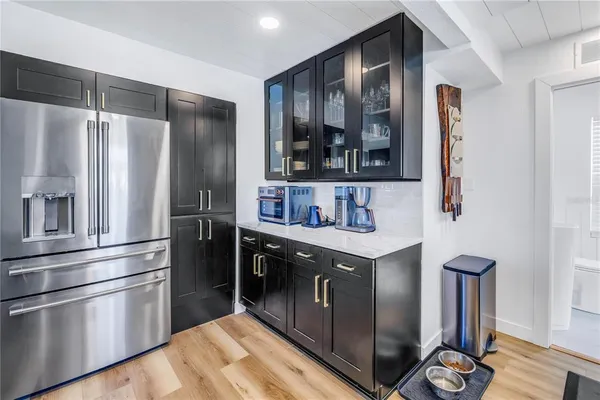 a bathroom with a toilet a sink and a window