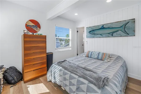 a bedroom with a bed and a table in it