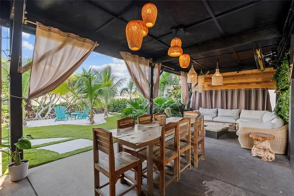 a dining room with outdoor seating and city view
