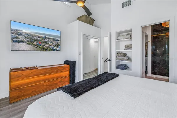 a bathroom with a granite countertop sink a mirror and shower