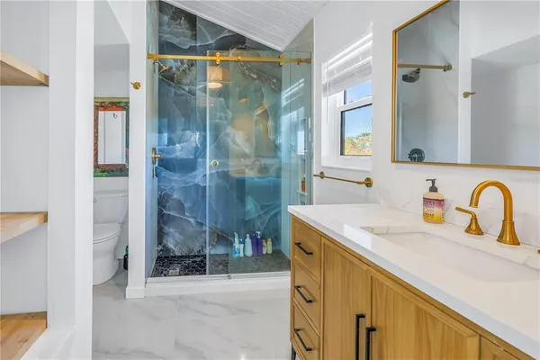 a spacious bathroom with a double vanity sink and a mirror