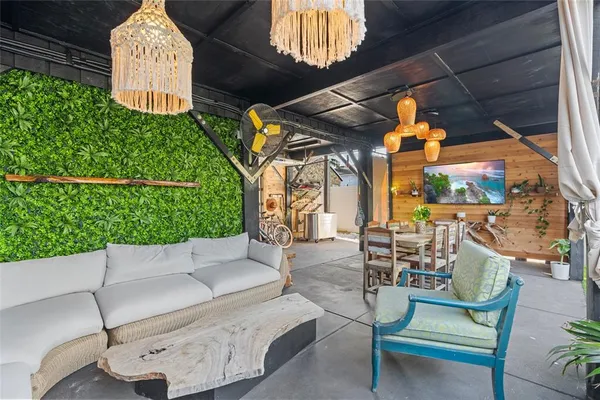 a view of a chairs and table in a patio