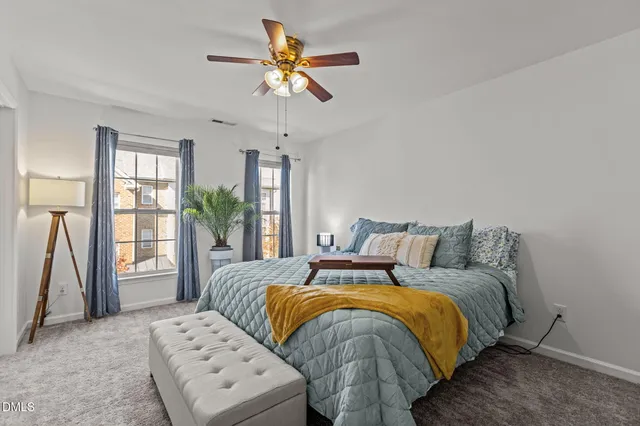 a bed room with a bed and a chandelier