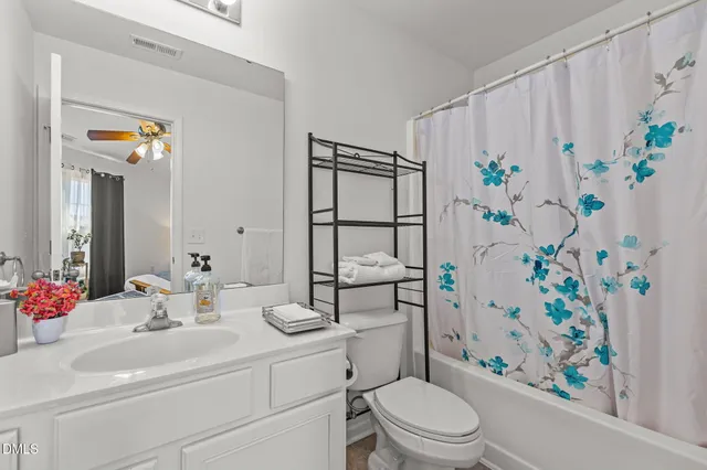 a room that has a sink and a mirror