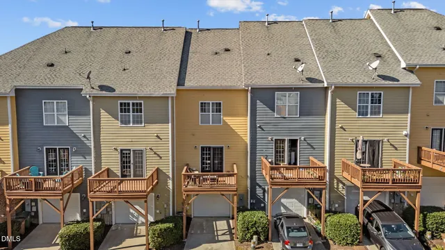an aerial view of multiple house with yard