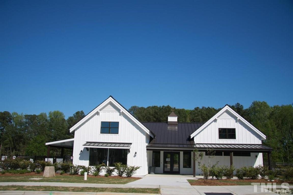 2919 Sunflower Road Apex, NC 27502 - Photo 32 of 34 a front view of a house with a yard