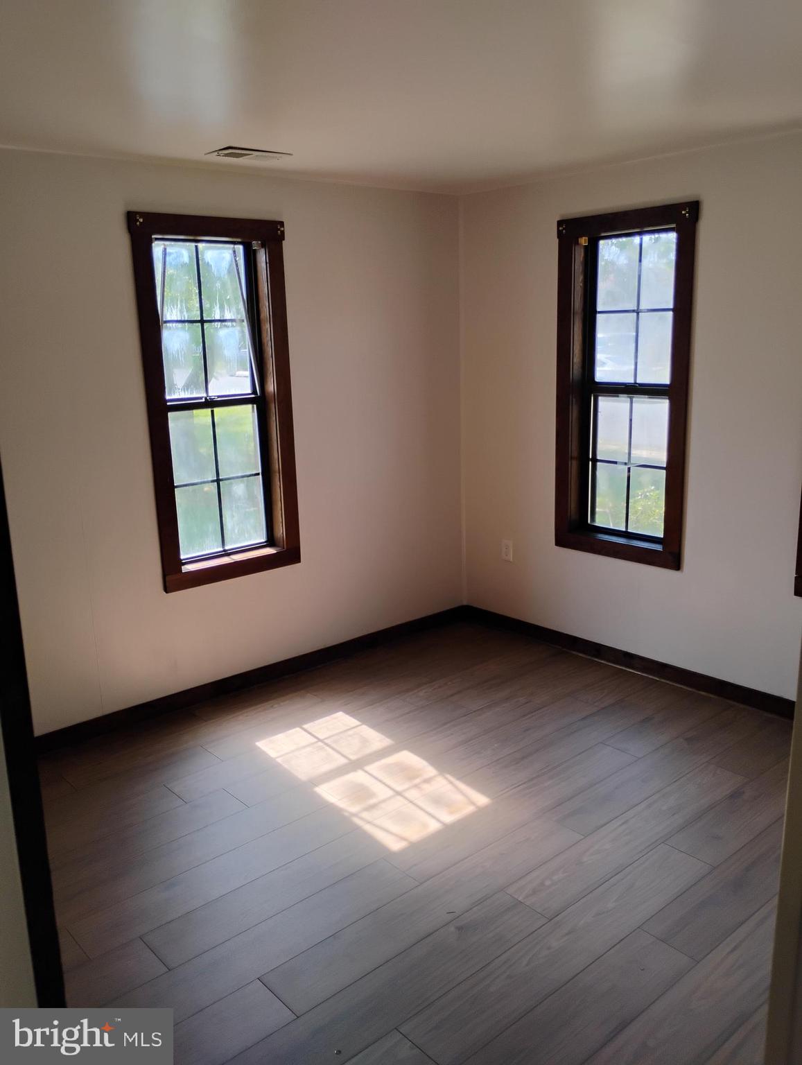 933 Andrews Road Glen Burnie, MD 21060 - Photo 12 of 22 an empty room with windows