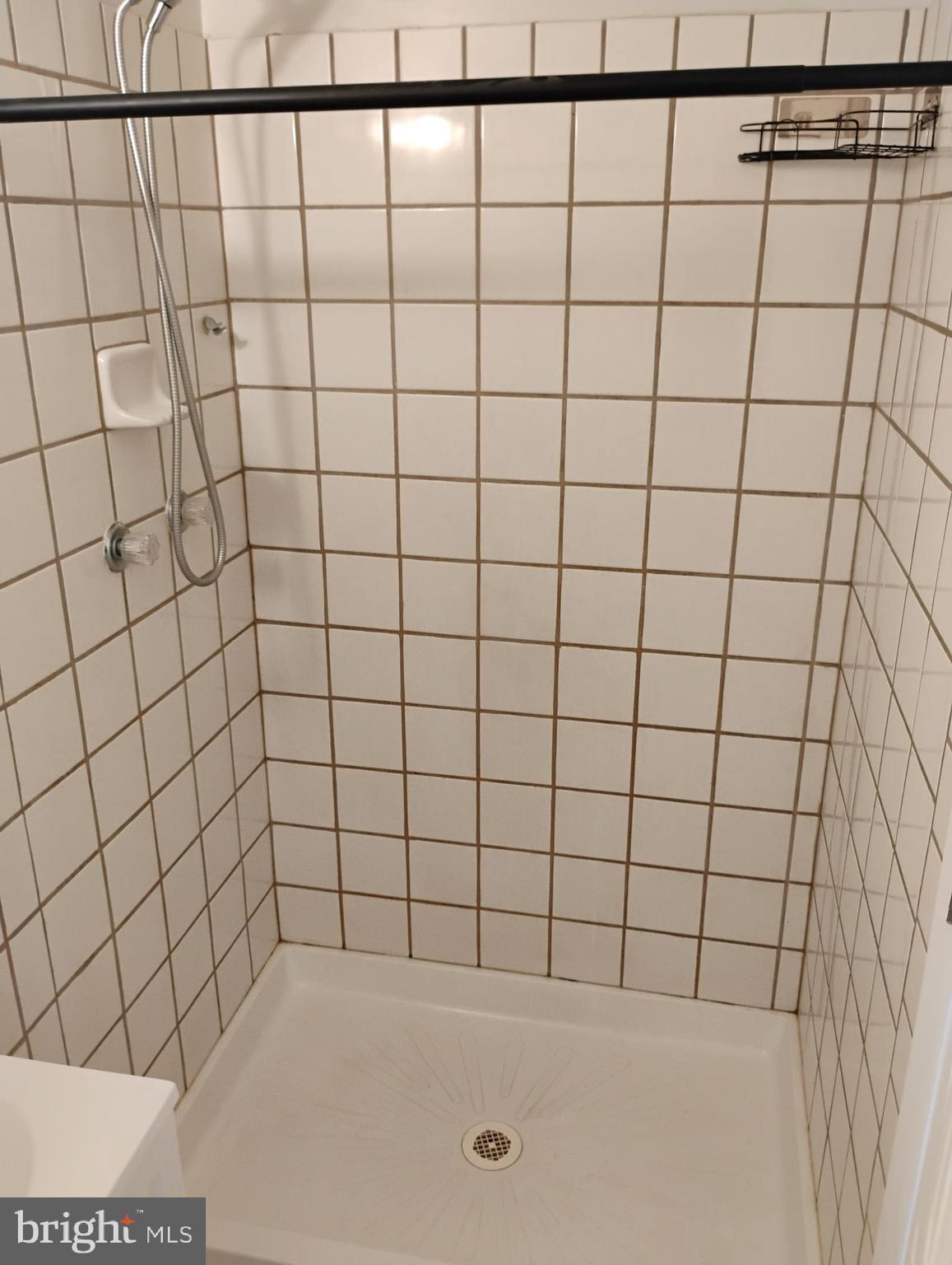 933 Andrews Road Glen Burnie, MD 21060 - Photo 16 of 22 a bathroom with a bathtub and shower