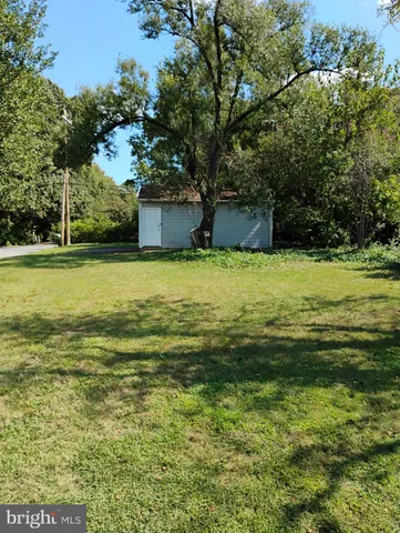 a backyard of a house with yard and garage