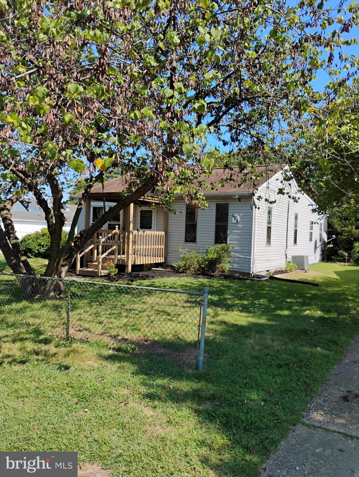 933 Andrews Road Glen Burnie, MD 21060 - Photo 3 of 22 a front view of house with a garden