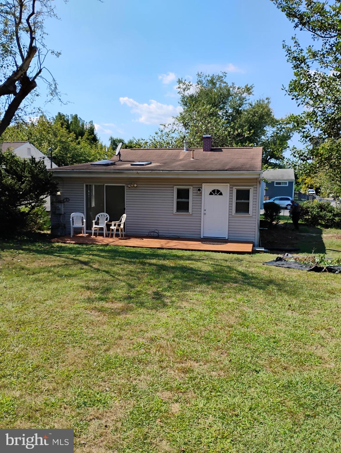 933 Andrews Road Glen Burnie, MD 21060 - Photo 4 of 22 a front view of house with yard and trees in the background