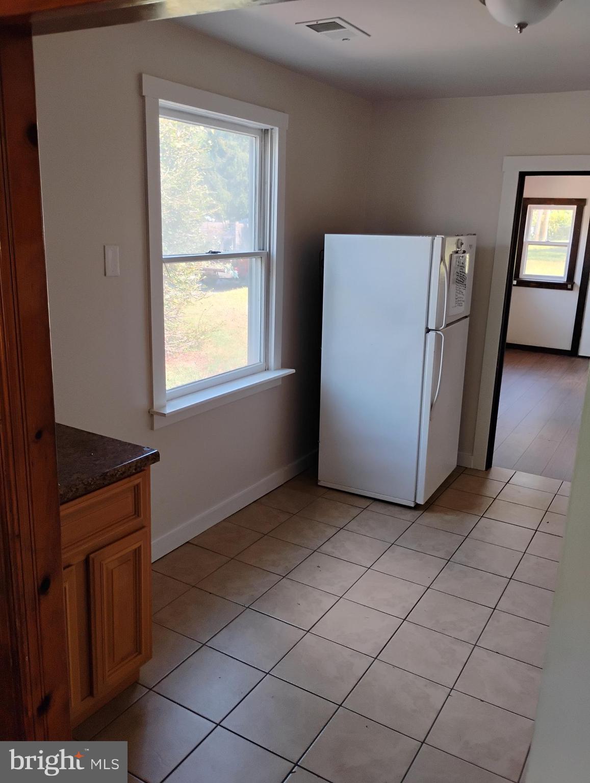 933 Andrews Road Glen Burnie, MD 21060 - Photo 9 of 22 an empty room with windows
