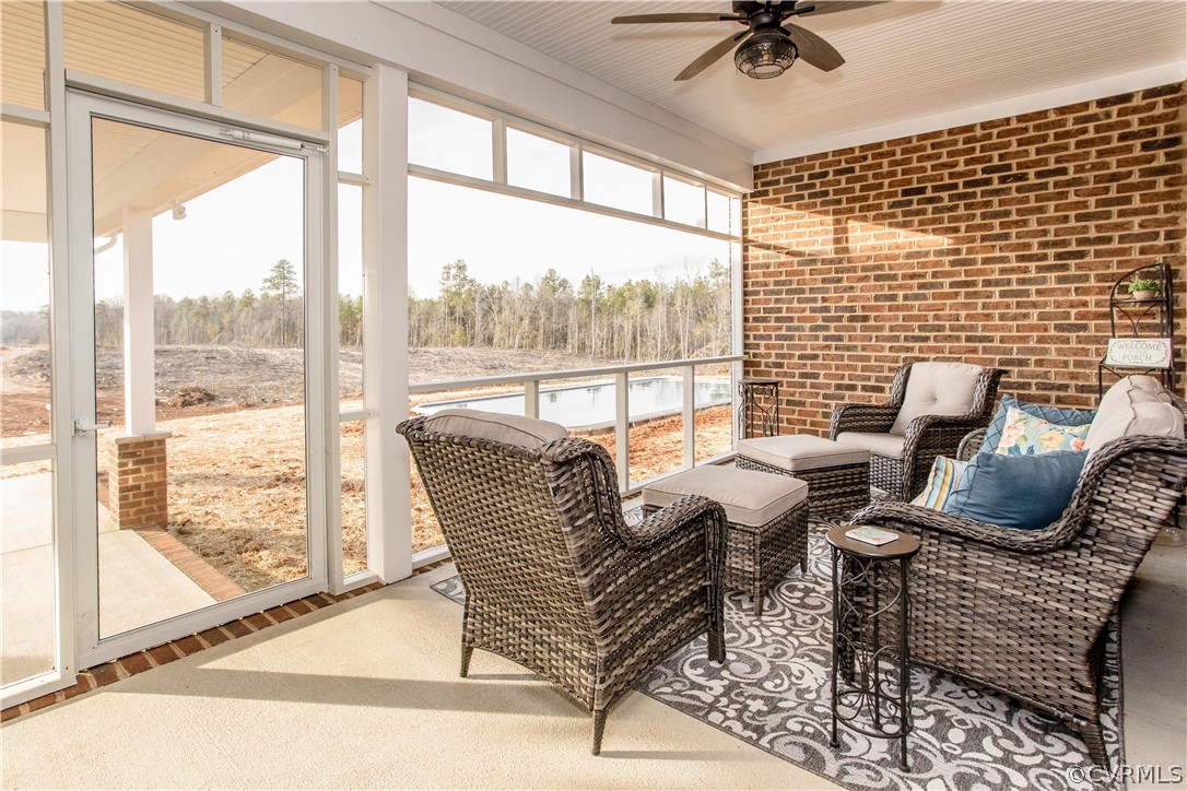 13790 Glebe Road Dewitt, VA 23840 - Photo 11 of 39 a living room with furniture and a floor to ceiling window