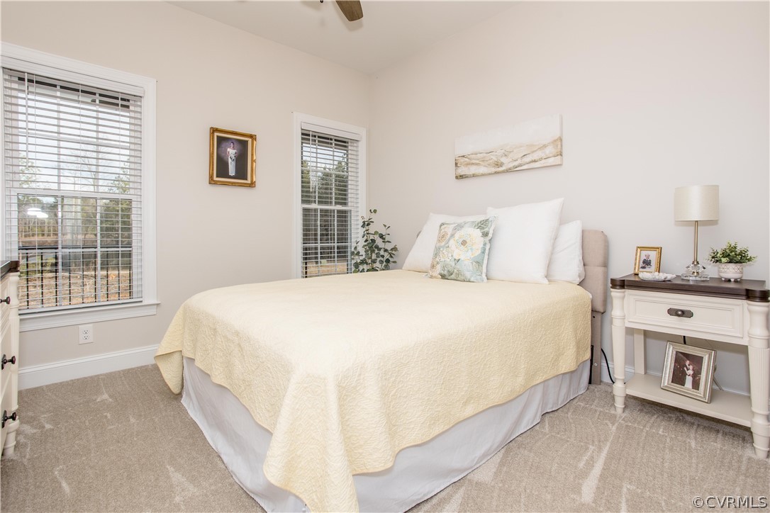 13790 Glebe Road Dewitt, VA 23840 - Photo 17 of 39 a spacious bedroom with a bed and a couch