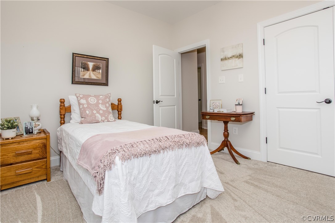 13790 Glebe Road Dewitt, VA 23840 - Photo 19 of 39 a bedroom with a bed and a table in it