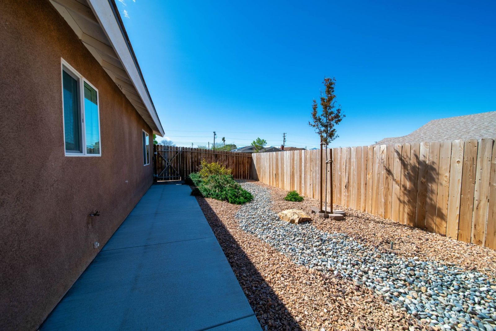1540 Mayo Street Ridgecrest, CA 93555 - Photo 27 of 32 a view of a pathway of a house with a yard