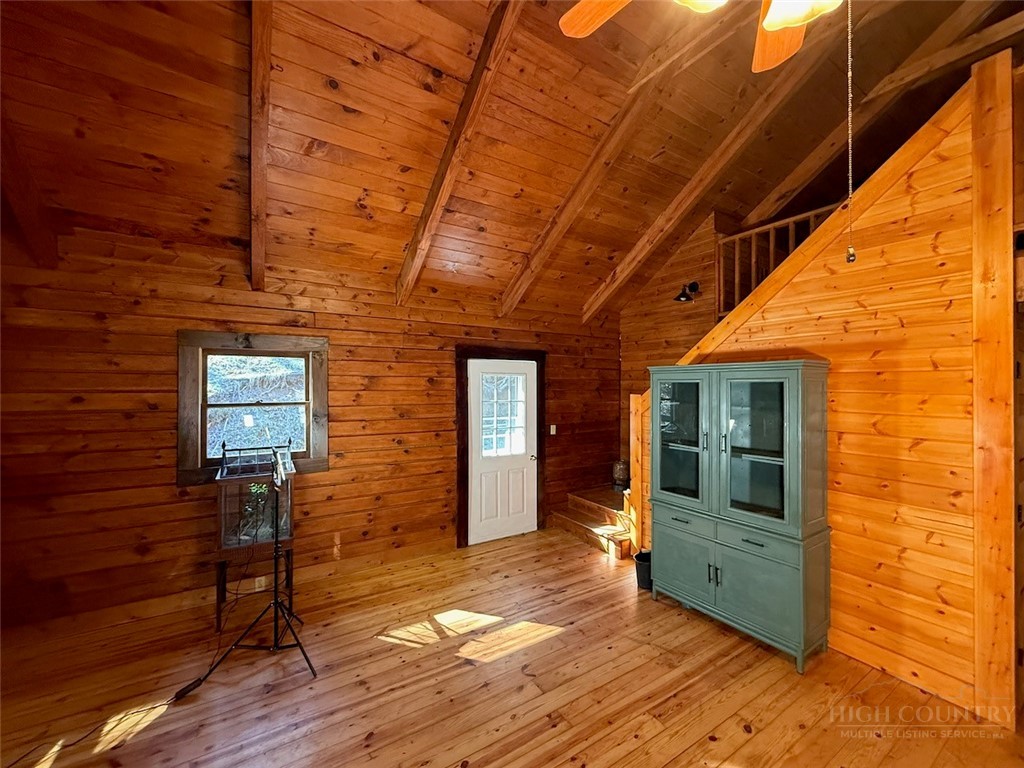 2291 Pine Swamp Road Fleetwood, NC 28626 - Photo 22 of 37 a view of a hallway with wooden floor and staircase