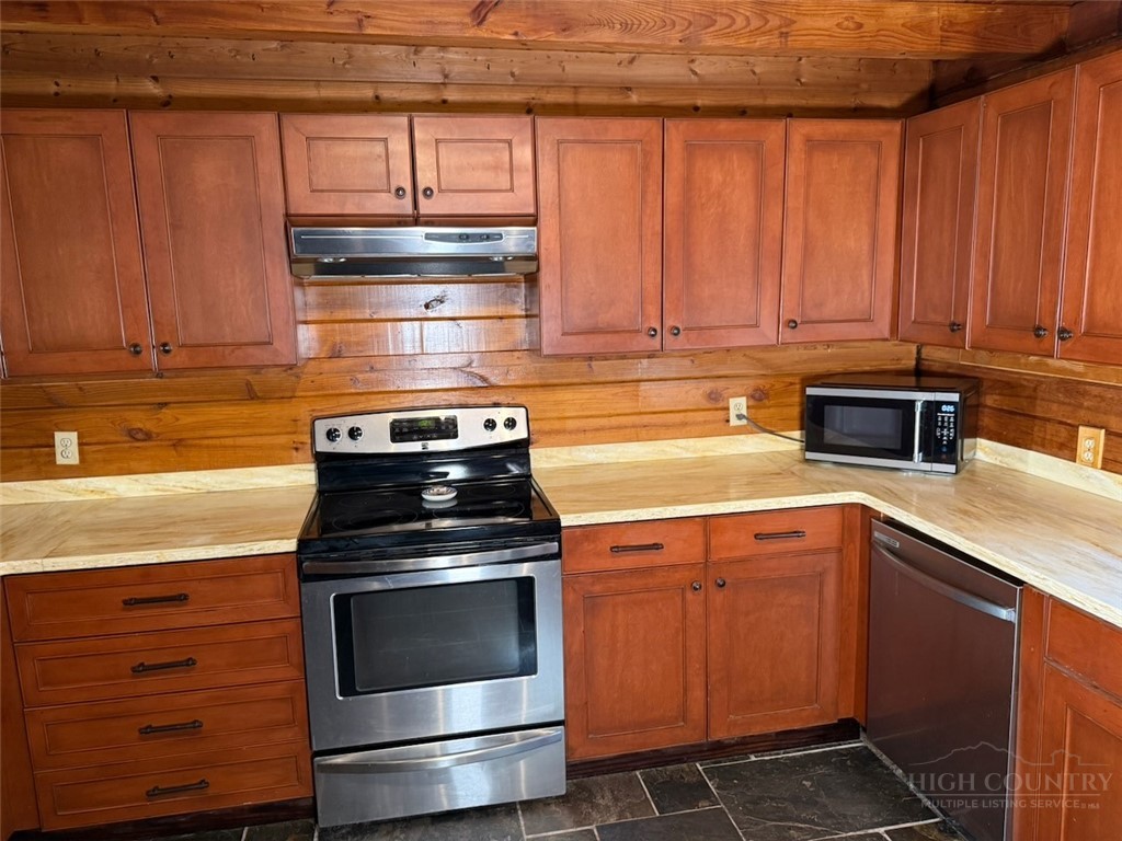 2291 Pine Swamp Road Fleetwood, NC 28626 - Photo 24 of 37 a kitchen with a stove and a microwave