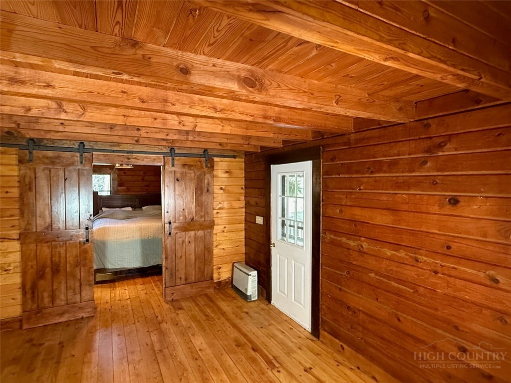 2291 Pine Swamp Road Fleetwood, NC 28626 - Photo 25 of 37 a view of empty room with wooden floor