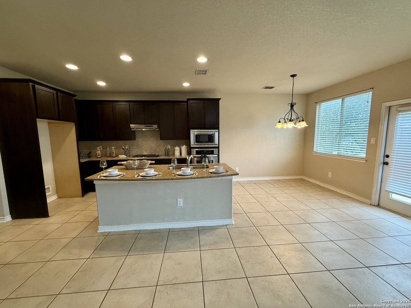 2930 Elm Tree Park San Antonio, TX 78259 - Photo 11 of 44 a kitchen with stainless steel appliances granite countertop a refrigerator and a sink