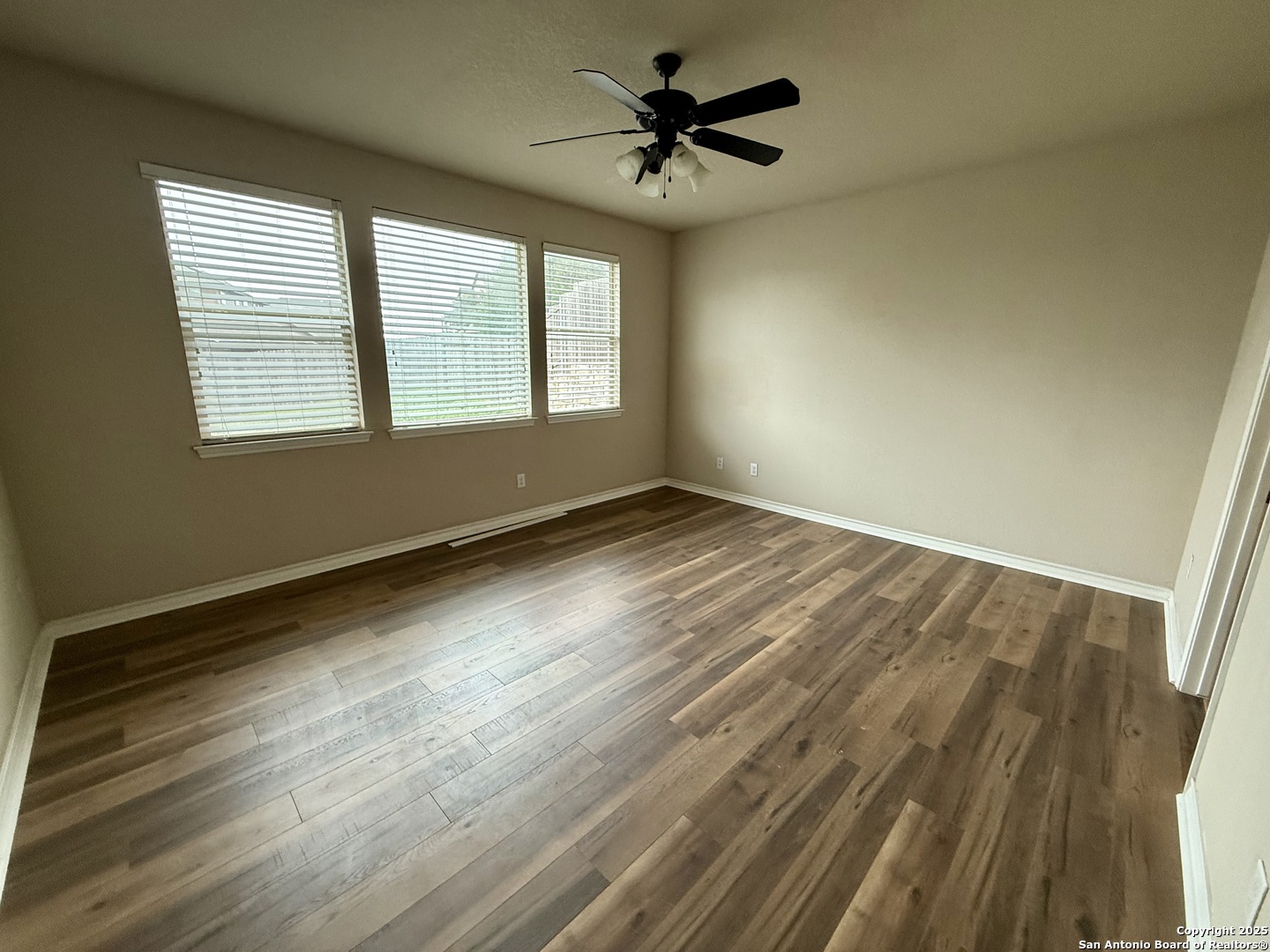 2930 Elm Tree Park San Antonio, TX 78259 - Photo 14 of 44 wooden floor in an empty room with a window