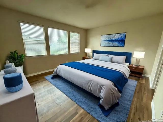 a kitchen with a sink refrigerator and cabinets