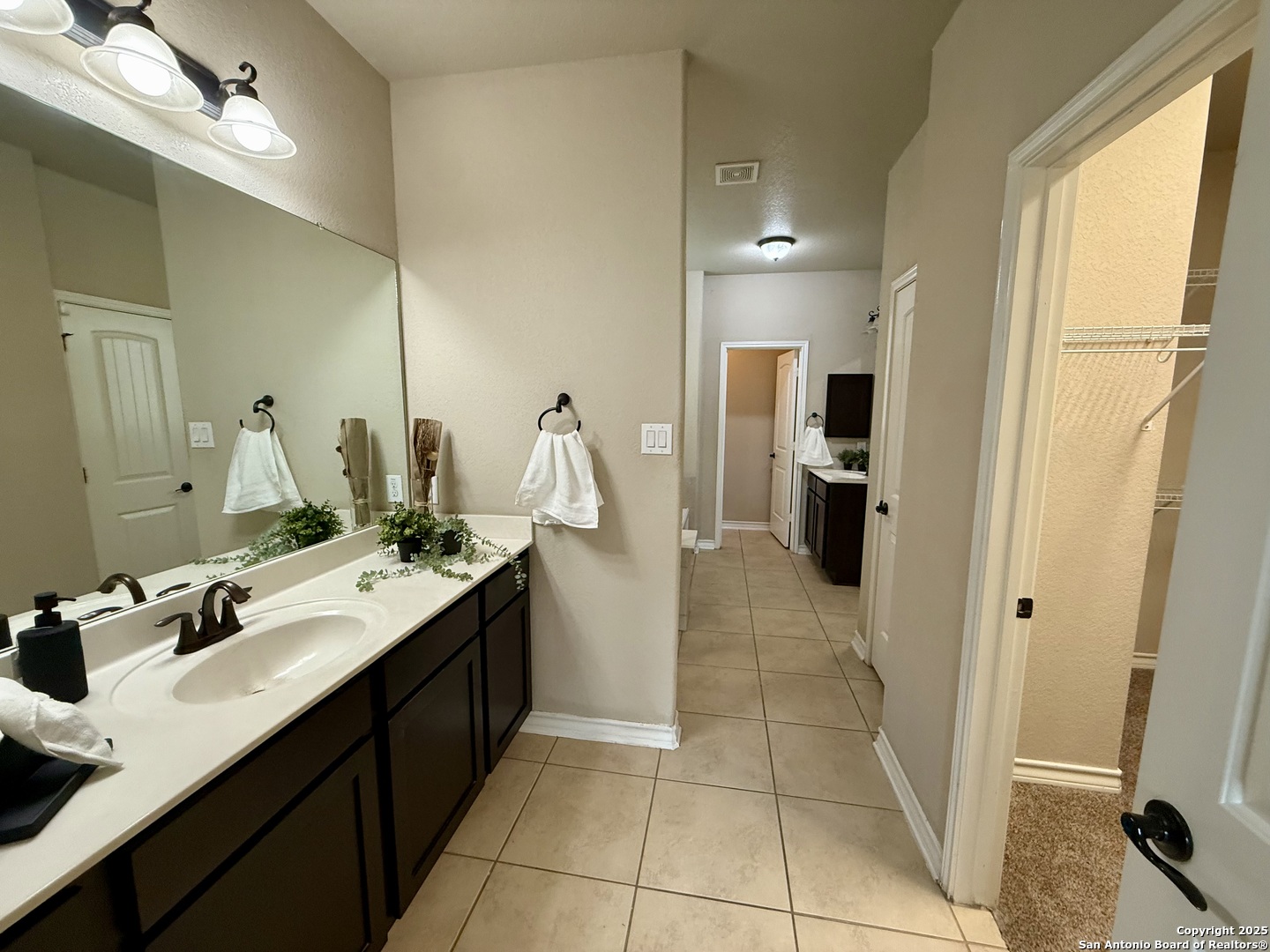 2930 Elm Tree Park San Antonio, TX 78259 - Photo 16 of 44 a kitchen with a sink refrigerator and cabinets