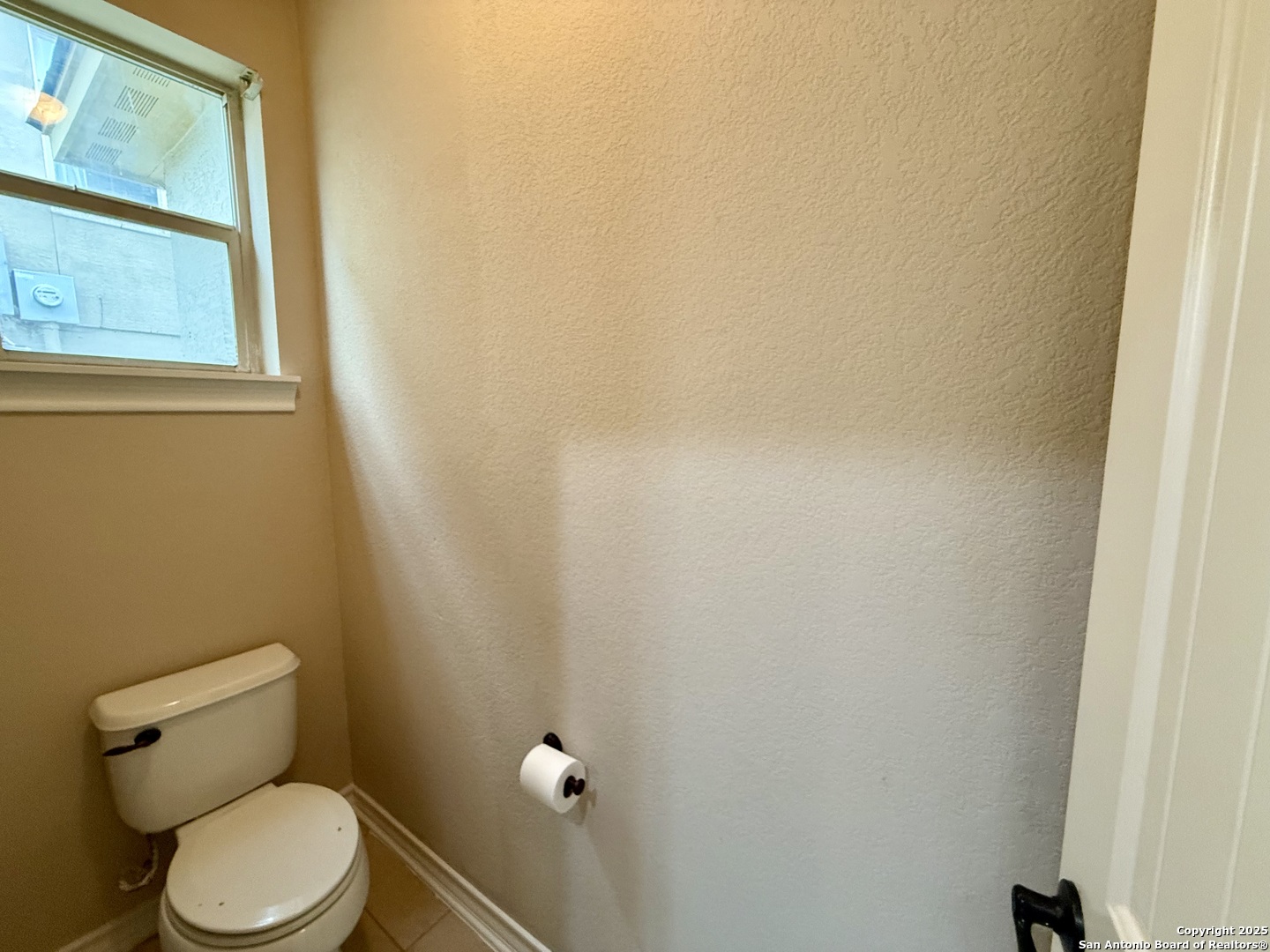 2930 Elm Tree Park San Antonio, TX 78259 - Photo 19 of 44 a white toilet sitting next to a window