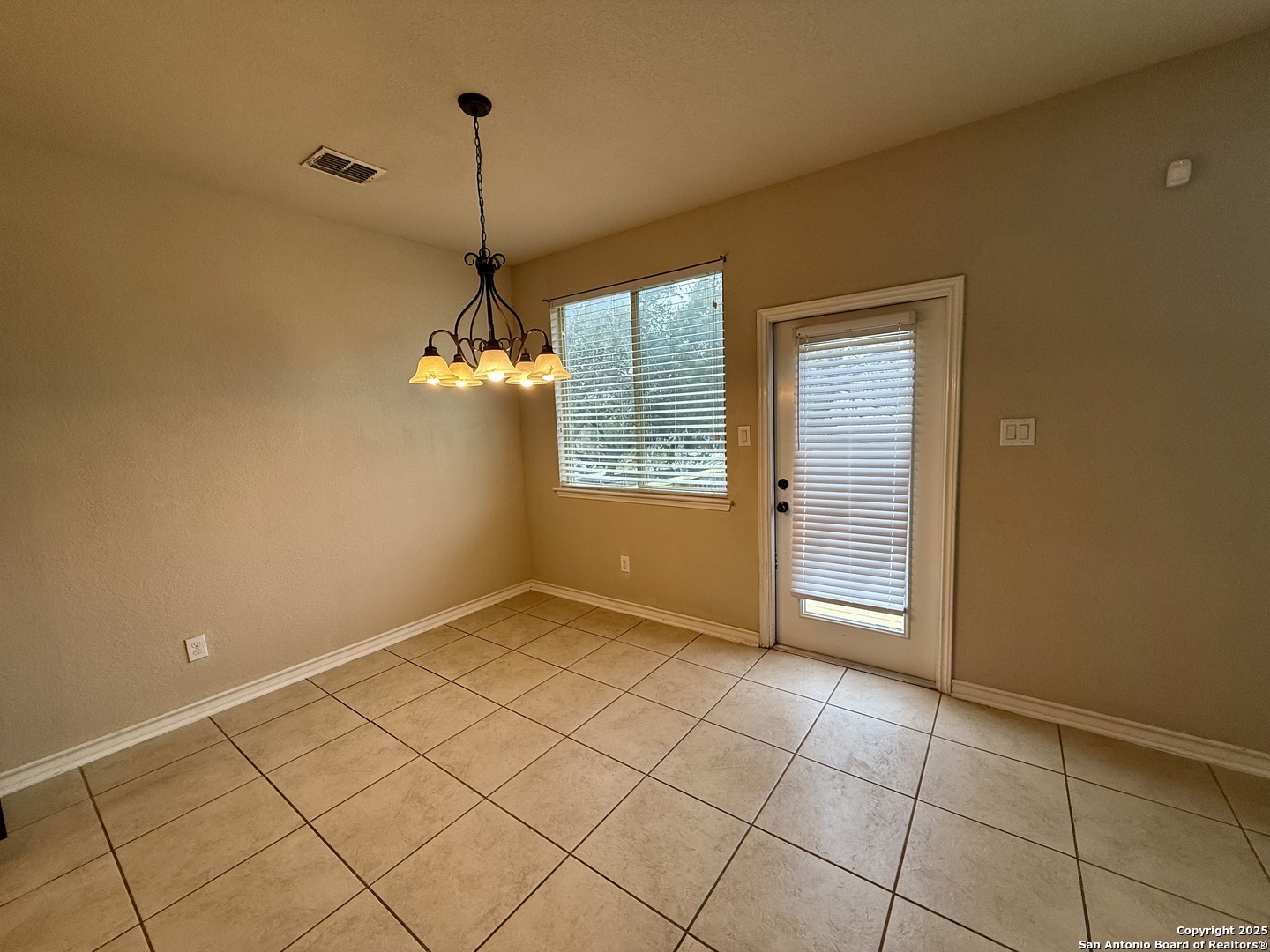 2930 Elm Tree Park San Antonio, TX 78259 - Photo 23 of 44 a view of an empty room with window and chandelier fan
