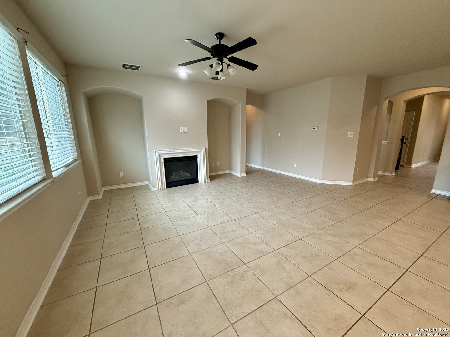 2930 Elm Tree Park San Antonio, TX 78259 - Photo 24 of 44 a view of an empty room with a ceiling fan and window