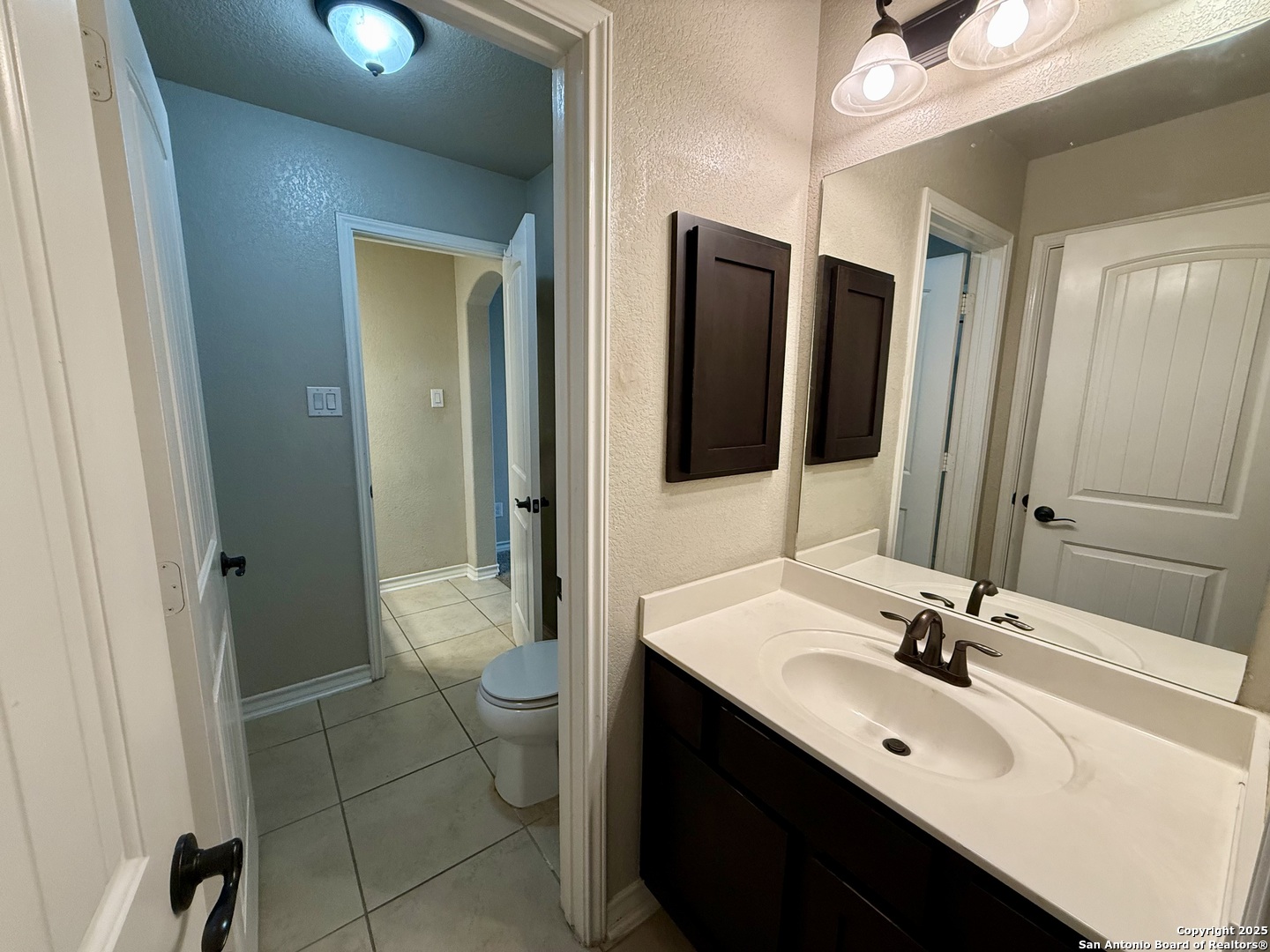2930 Elm Tree Park San Antonio, TX 78259 - Photo 31 of 44 a bathroom with a double vanity sink toilet and shower